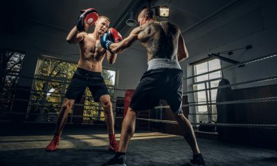 Two sportive men have a boxing competition on the ring